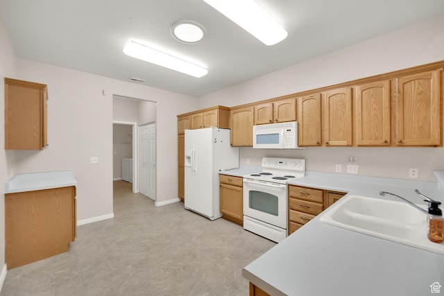6953 S Country Home Ln W, West Jordan, UT 84084 - kitchen featuring a sink, light floors, white appliances, and light countertops