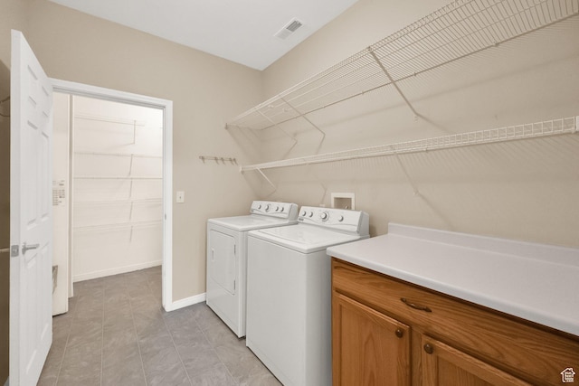 6953 S Country Home Ln W, West Jordan, UT 84084 - laundry room with baseboards, visible vents, and washer and dryer