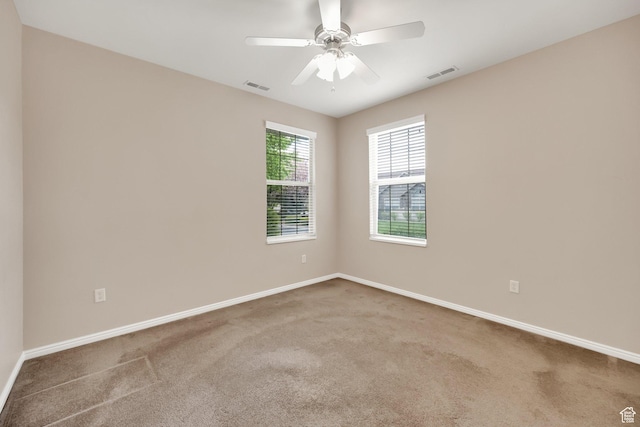 6953 S Country Home Ln W, West Jordan, UT 84084 - carpeted spare room with a ceiling fan, baseboards, and visible vents