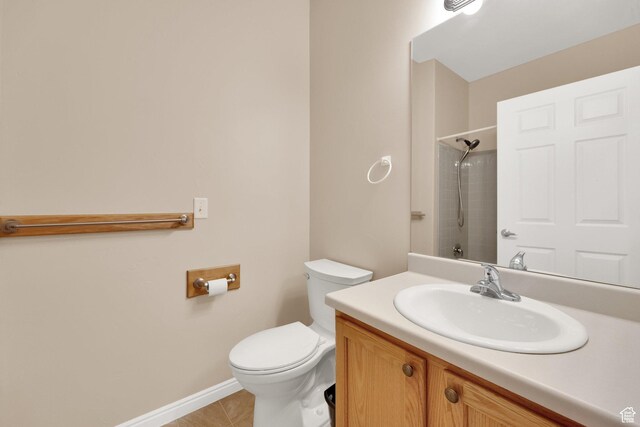 6953 S Country Home Ln W, West Jordan, UT 84084 - full bathroom featuring tile patterned flooring, vanity, toilet, baseboards, and a shower
