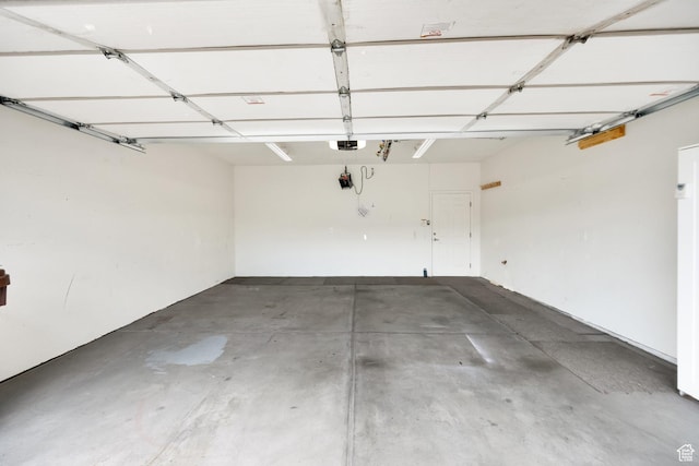 6953 S Country Home Ln W, West Jordan, UT 84084 - garage featuring a garage door opener