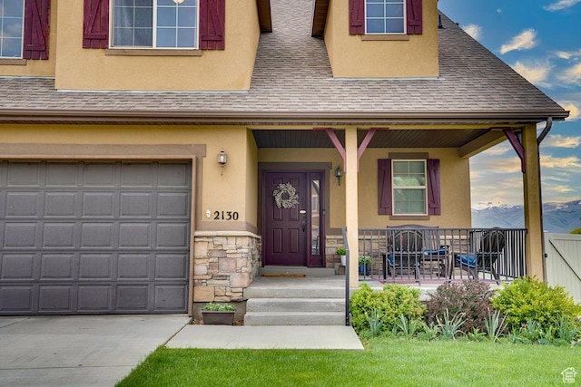 2130 S 450 E, Heber City, UT 84032 - view of front facade with a porch, stone siding, roof with shingles, and stucco siding