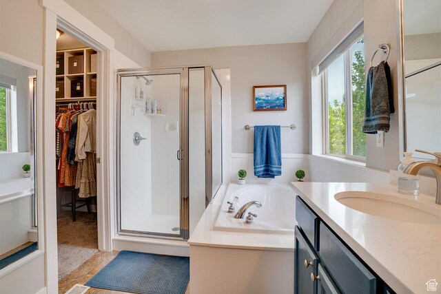 2130 S 450 E, Heber City, UT 84032 - full bathroom with vanity, a shower stall, a bath, and a wealth of natural light