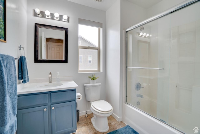 2130 S 450 E, Heber City, UT 84032 - bathroom featuring vanity, toilet, baseboards, stone finish floor, and combined bath / shower with glass door