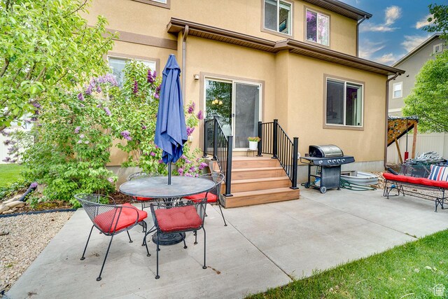 2130 S 450 E, Heber City, UT 84032 - rear view of house with outdoor dining area, a patio, and stucco siding
