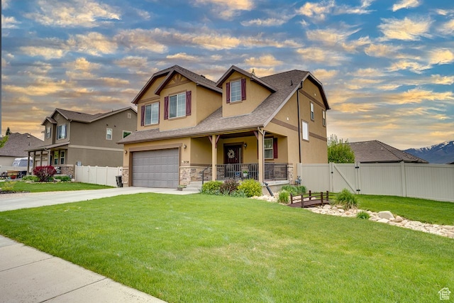 2130 S 450 E, Heber City, UT 84032 - craftsman-style house featuring fence, stone siding, a garage, stucco siding, and driveway