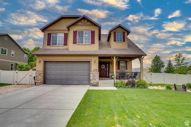2130 S 450 E, Heber City, UT 84032 - craftsman-style home with a porch, a gate, a front lawn, an attached garage, and stucco siding