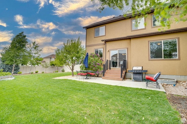 2130 S 450 E, Heber City, UT 84032 - rear view of house with fence, a patio, stucco siding, entry steps, and a yard