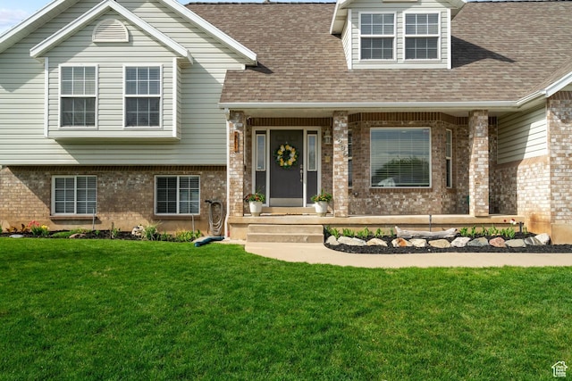 2295 E 2150 N, Layton, UT 84040 - view of front of home with a shingled roof, a front lawn, and brick siding