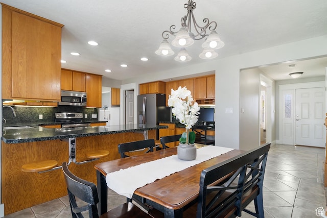 2295 E 2150 N, Layton, UT 84040 - dining space with light tile patterned floors, recessed lighting, and a chandelier