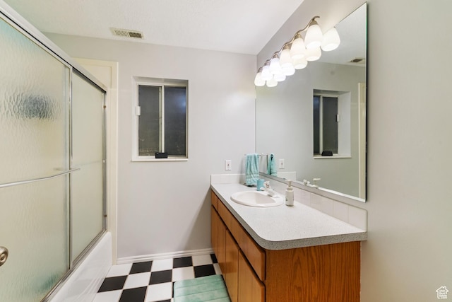 2295 E 2150 N, Layton, UT 84040 - bathroom featuring visible vents, bath / shower combo with glass door, tile patterned floors, and vanity