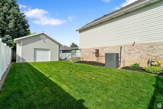 2295 E 2150 N, Layton, UT 84040 - view of yard featuring a fenced backyard, a playground, central air condition unit, an outbuilding, and a detached garage