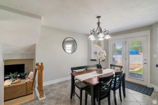 2295 E 2150 N, Layton, UT 84040 - dining room with baseboards, a textured ceiling, an inviting chandelier, and tile patterned floors