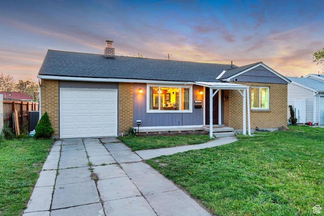 1072 S 1400 W, Salt Lake City, UT 84104 - ranch-style home with a lawn, fence, a chimney, and brick siding