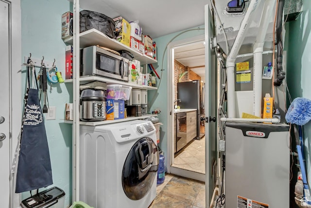 1072 S 1400 W, Salt Lake City, UT 84104 - laundry area featuring laundry area, washer / dryer, and heating unit