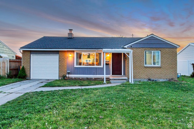 1072 S 1400 W, Salt Lake City, UT 84104 - ranch-style house with driveway, a garage, brick siding, fence, and a front lawn