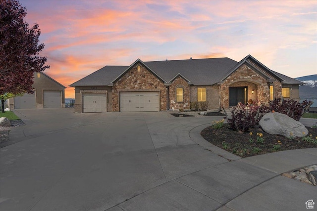 3630 S Panorama Dr W, Saratoga Springs, UT 84045 - french provincial home featuring an attached garage, driveway, and stone siding