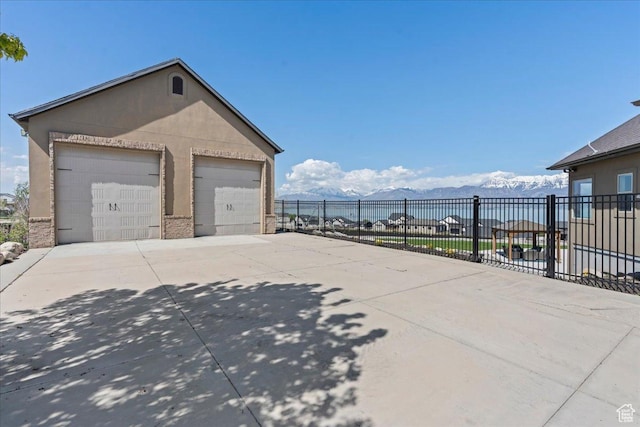 3630 S Panorama Dr W, Saratoga Springs, UT 84045 - detached garage featuring a mountain view and fence