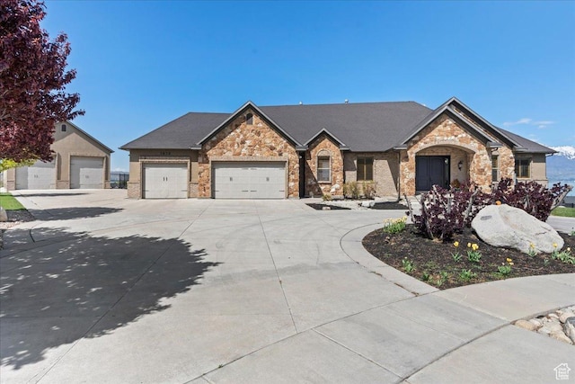 3630 S Panorama Dr W, Saratoga Springs, UT 84045 - view of front of home featuring an attached garage, driveway, and stone siding