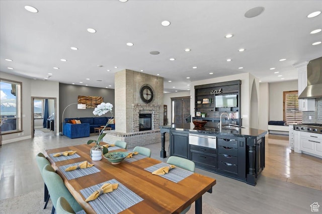 3630 S Panorama Dr W, Saratoga Springs, UT 84045 - dining room with recessed lighting, a wealth of natural light, and a fireplace
