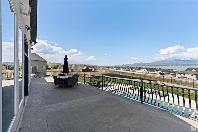 3630 S Panorama Dr W, Saratoga Springs, UT 84045 - view of patio featuring outdoor dining area, a swimming pool, a mountain view, and fence