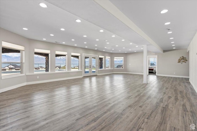 3630 S Panorama Dr W, Saratoga Springs, UT 84045 - unfurnished living room with baseboards, french doors, recessed lighting, and wood finished floors