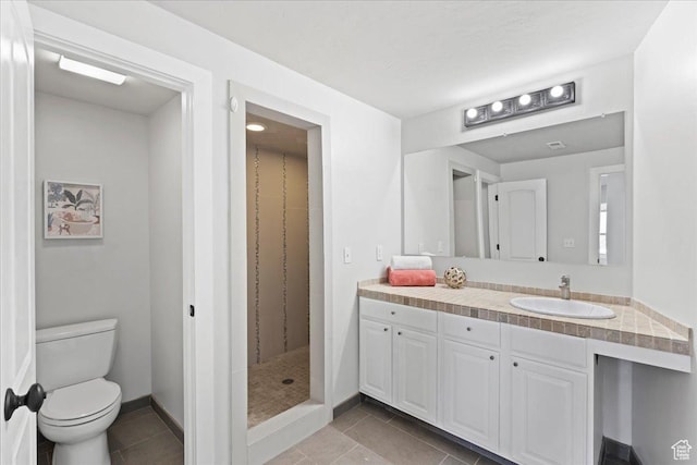 3630 S Panorama Dr W, Saratoga Springs, UT 84045 - bathroom featuring vanity, a stall shower, tile patterned floors, and toilet