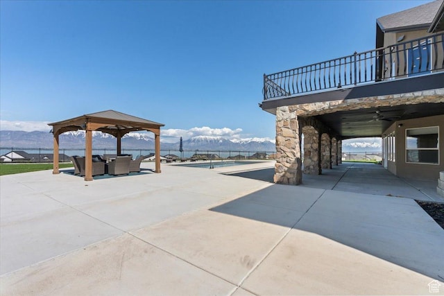 3630 S Panorama Dr W, Saratoga Springs, UT 84045 - view of patio / terrace featuring outdoor lounge area, fence, a balcony, a gazebo, and a mountain view
