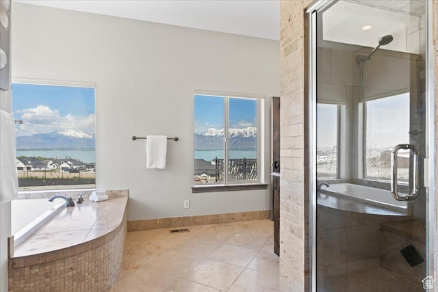 3630 S Panorama Dr W, Saratoga Springs, UT 84045 - full bathroom featuring plenty of natural light, tile patterned floors, a stall shower, and a tub to relax in