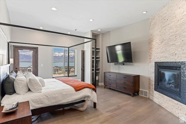 3630 S Panorama Dr W, Saratoga Springs, UT 84045 - bedroom with access to outside, recessed lighting, wood finished floors, and visible vents
