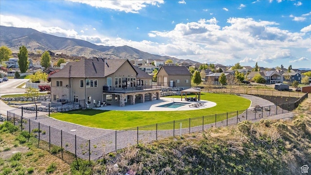3630 S Panorama Dr W, Saratoga Springs, UT 84045 - back of house featuring a gazebo, a fenced backyard, a yard, and a residential view