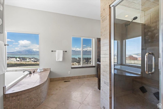 3630 S Panorama Dr W, Saratoga Springs, UT 84045 - full bathroom featuring a garden tub, visible vents, a stall shower, tile patterned floors, and baseboards