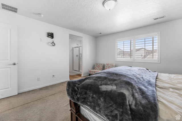 728 W Wild Hyacinth Dr, Saratoga Springs, UT 84045 - carpeted bedroom featuring visible vents, a textured ceiling, ensuite bath, and baseboards