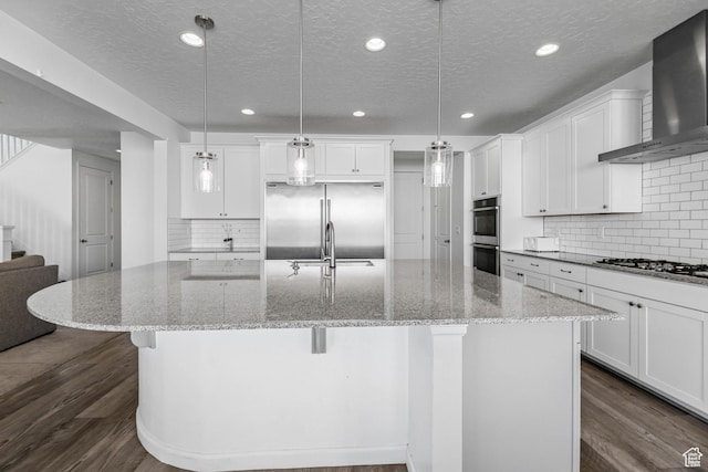 728 W Wild Hyacinth Dr, Saratoga Springs, UT 84045 - kitchen featuring wall chimney range hood, stainless steel appliances, dark wood-style flooring, and a textured ceiling