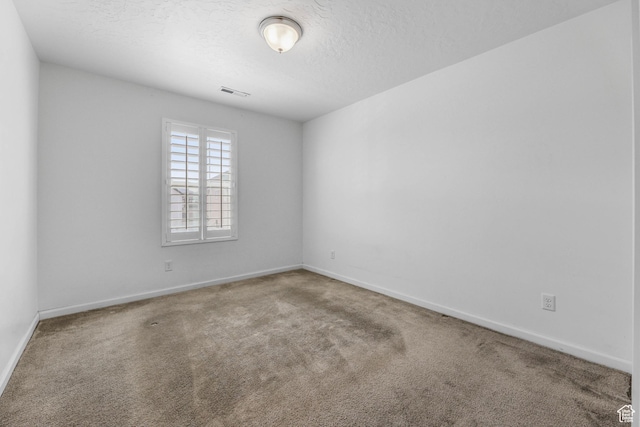 728 W Wild Hyacinth Dr, Saratoga Springs, UT 84045 - carpeted spare room with baseboards, a textured ceiling, and visible vents