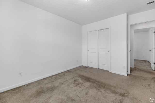 728 W Wild Hyacinth Dr, Saratoga Springs, UT 84045 - unfurnished bedroom featuring visible vents, baseboards, carpet floors, and a closet