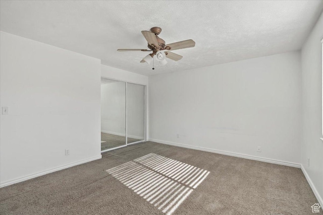 12455 S 1450 W, Riverton, UT 84065 - unfurnished bedroom with a closet, baseboards, ceiling fan, and carpet flooring