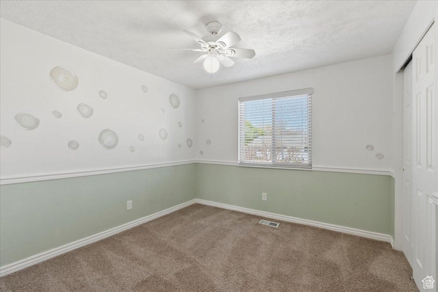12455 S 1450 W, Riverton, UT 84065 - unfurnished room with a textured ceiling, carpet, a ceiling fan, baseboards, and visible vents
