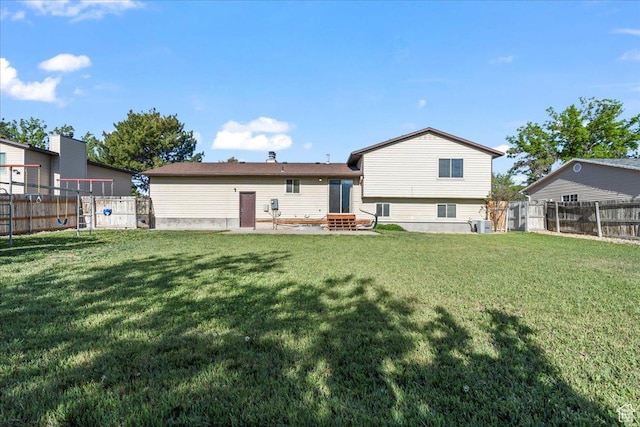 12455 S 1450 W, Riverton, UT 84065 - back of house with a lawn, a fenced backyard, and entry steps