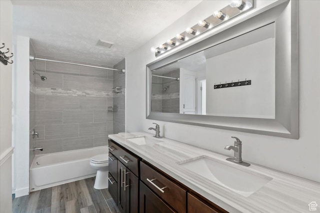 12455 S 1450 W, Riverton, UT 84065 - bathroom with a sink, a textured ceiling, wood finished floors, and toilet