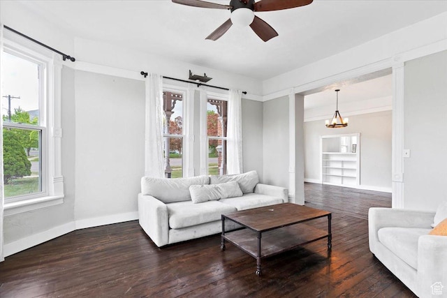 95 N 200 W, Brigham City, UT 84302 - living room featuring baseboards, ceiling fan with notable chandelier, and wood finished floors