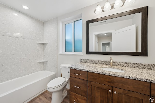735 E 850 S, Centerville, UT 84014 - bathroom featuring vanity, wood finished floors, toilet, and tub / shower combination