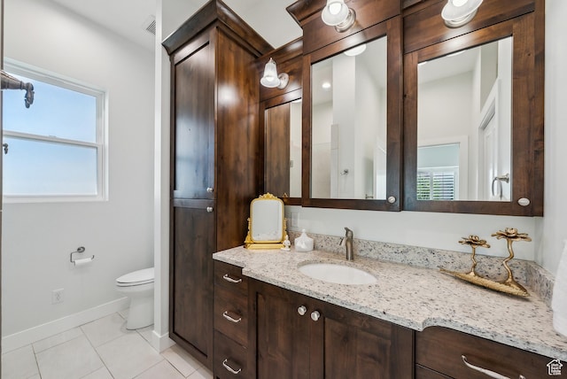 735 E 850 S, Centerville, UT 84014 - bathroom featuring vanity, toilet, baseboards, and tile patterned flooring