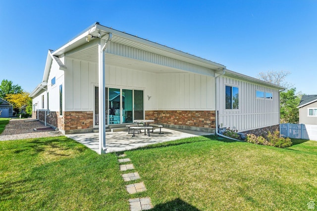 735 E 850 S, Centerville, UT 84014 - rear view of property featuring a patio, board and batten siding, and brick siding