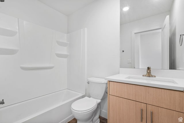 bathroom with toilet, tub / shower combination, and vanity