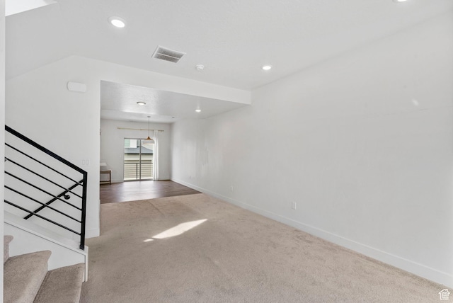 interior space with baseboards, recessed lighting, carpet, and stairway