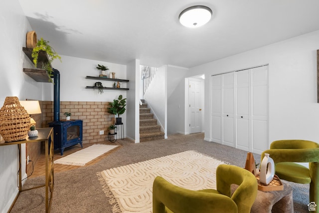 3102 S Applewood Dr E, Bountiful, UT 84010 - interior space with stairway, baseboards, a wood stove, and carpet flooring