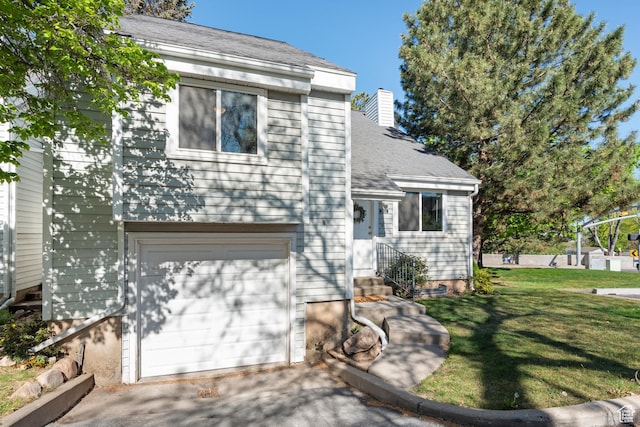 3102 S Applewood Dr E, Bountiful, UT 84010 - split level home with an attached garage, a front lawn, entry steps, a chimney, and driveway
