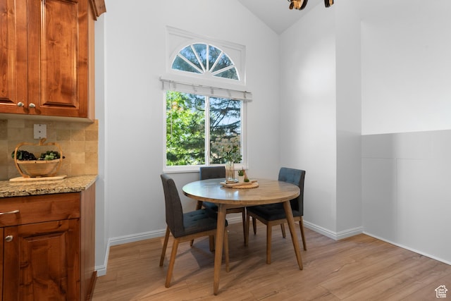 3102 S Applewood Dr E, Bountiful, UT 84010 - dining space with baseboards, light wood-style flooring, and lofted ceiling