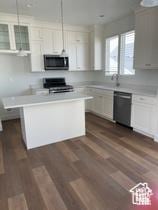 10983 S Lake Run Rd, South Jordan, UT 84009 - kitchen with stainless steel microwave, dishwasher, stove, light countertops, and a center island